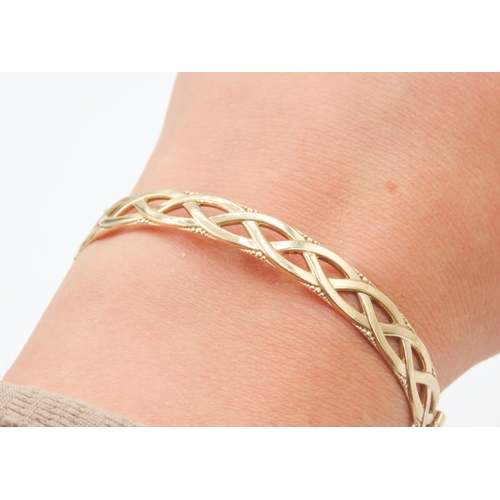 179 - 9 Carat Yellow Gold Celtic Knot Bangle Bracelet with Safety Chain Inner Width 6.5cm