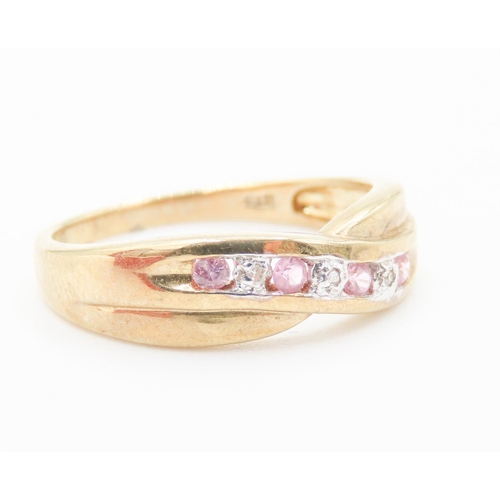 181 - Pink Tourmaline and Diamond Set Crossover Form Ring Mounted in 9 Carat Yellow Gold Ring Size P