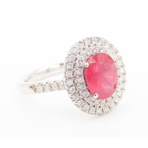 202 - Ruby Set Centre Stone Ring Mounted in Platinum with Diamond Set Double Halo Surround and Further Dia... 