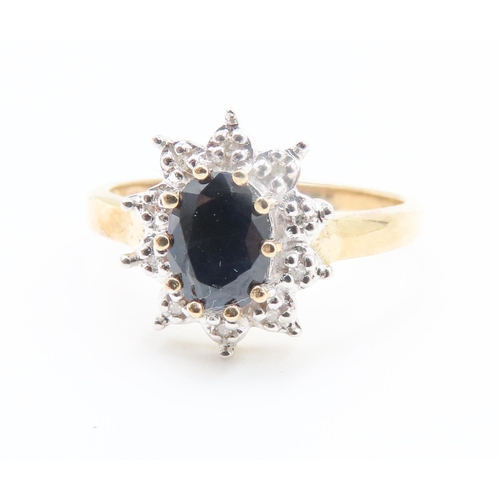 224 - Sapphire and Diamond Set Ladies Cluster Ring Mounted in 9 Carat Yellow Gold Ring Size M and a Half