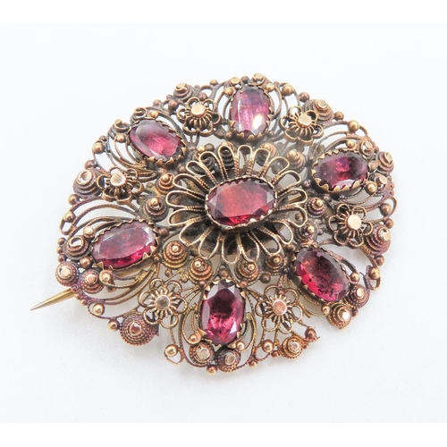 228 - Victorian 9 Carat Yellow Gold Red Garnet Decorated Brooch 4cm Wide Oval Form