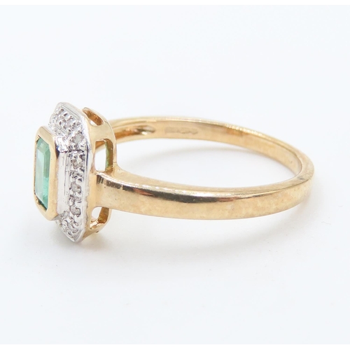 232 - Bezel Set Emerald Ring with Diamond Set Halo Surround Mounted in 9 Carat Yellow Gold Ring Size L