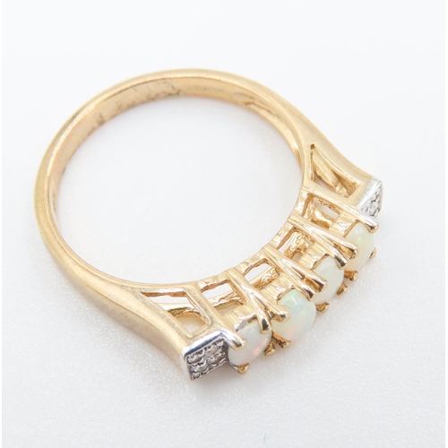 233 - Four Stone Opal Set Ring Mounted in 9 Carat Yellow Gold Further Diamonds Set to Shoulders Ring Size ... 