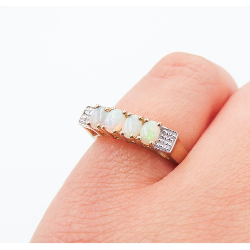 233 - Four Stone Opal Set Ring Mounted in 9 Carat Yellow Gold Further Diamonds Set to Shoulders Ring Size ... 