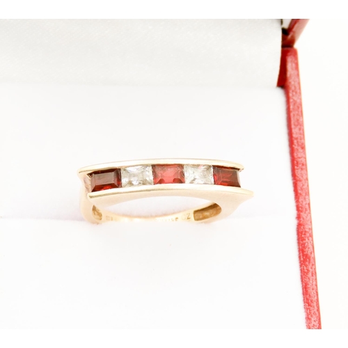 27 - Five Stone Red Garnet and Gemstone Channel Set Ring Mounted in 9 Carat Yellow Gold Ring Size O