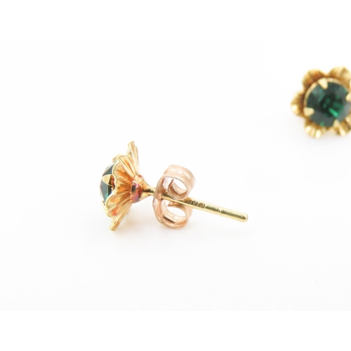 466 - Pair of Gemstone set 9 Carat Yellow Gold Floral Form Earrings