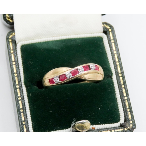 71 - Nine Stone Ruby and Diamond Set Crossover Motif Ring Mounted in 9 Carat Yellow Gold Ring Size M