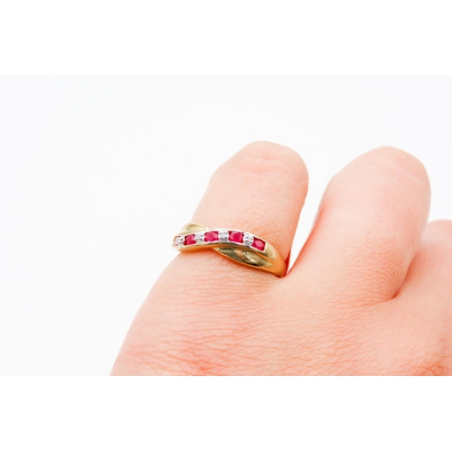 71 - Nine Stone Ruby and Diamond Set Crossover Motif Ring Mounted in 9 Carat Yellow Gold Ring Size M