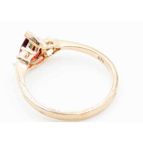 74 - Pear Cut Red Garnet Ring Mounted in 9 Carat Yellow Gold Further Diamonds Set to Shoulders Ring Size ... 