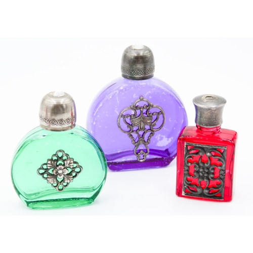 78 - Three Perfume Bottles Green Purple and Red Glass Attractively Detailed Silver Set Tallest 5.5cm High