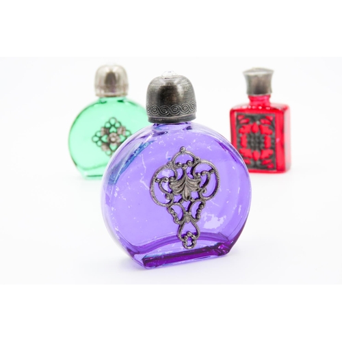 78 - Three Perfume Bottles Green Purple and Red Glass Attractively Detailed Silver Set Tallest 5.5cm High