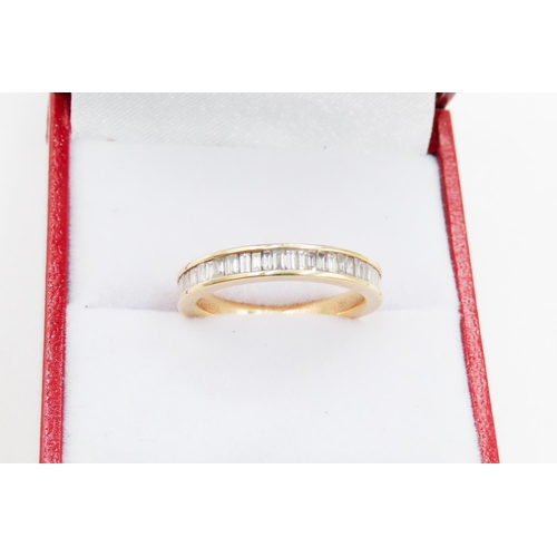 86 - Diamond Emerald Cut Set Half Eternity Ring Mounted in 18 Carat Yellow Gold Ring Size L