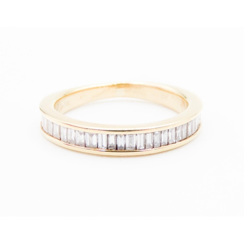 86 - Diamond Emerald Cut Set Half Eternity Ring Mounted in 18 Carat Yellow Gold Ring Size L