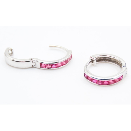 107 - Pair of Ruby Set Hoop Earrings Mounted in 18 Carat White Gold 11mm High