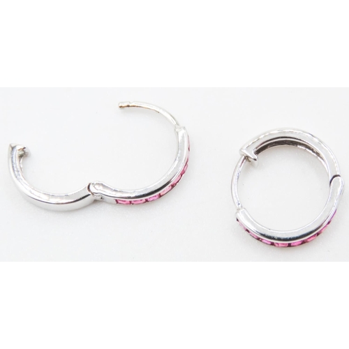 107 - Pair of Ruby Set Hoop Earrings Mounted in 18 Carat White Gold 11mm High