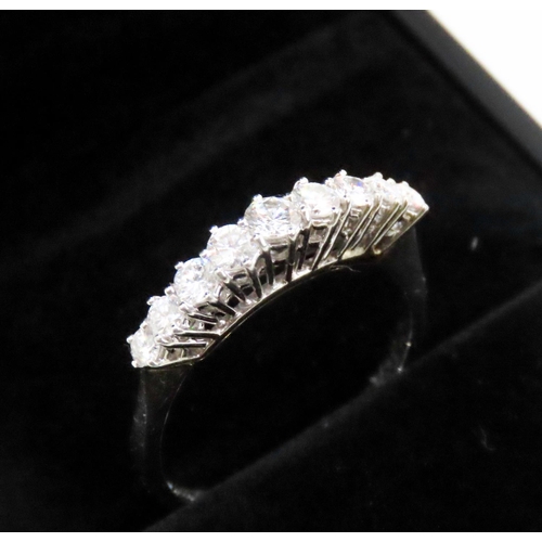 124 - Diamond Nine Stone Graduated Form Basket Set Ring Mounted in 18 Carat White Gold Ring Size R