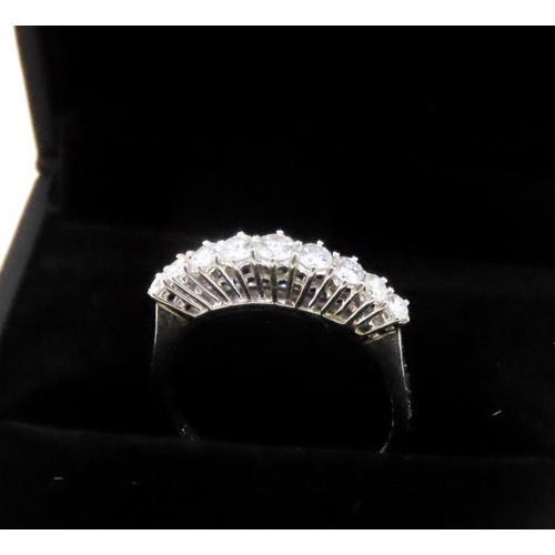 124 - Diamond Nine Stone Graduated Form Basket Set Ring Mounted in 18 Carat White Gold Ring Size R