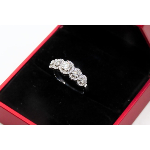 128 - Diamond Five Stone Ring Mounted in 18 Carat White Gold with Diamond Set Halo Surround Ring Size N