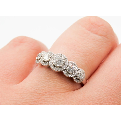 128 - Diamond Five Stone Ring Mounted in 18 Carat White Gold with Diamond Set Halo Surround Ring Size N