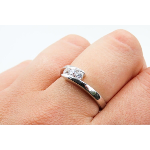 131 - Three Stone Gem Set Wrap Around Form Ring Mounted in 9 Carat White Gold Ring Size Q