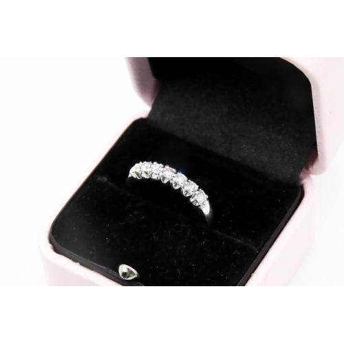 133 - Diamond Seven Stone Belcher Set Ring Mounted in 18 Carat White Gold Ring Size M and a Half