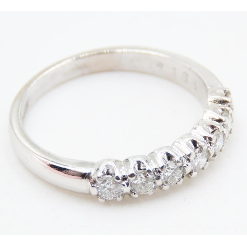 133 - Diamond Seven Stone Belcher Set Ring Mounted in 18 Carat White Gold Ring Size M and a Half