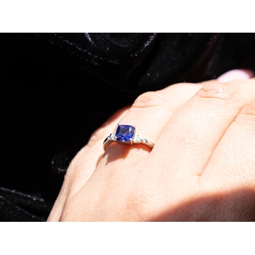 151 - Cushion Cut Tanzanite Set Ring with Further Tapered Baguette Cut Diamonds to Shoulders Mounted in Pl... 