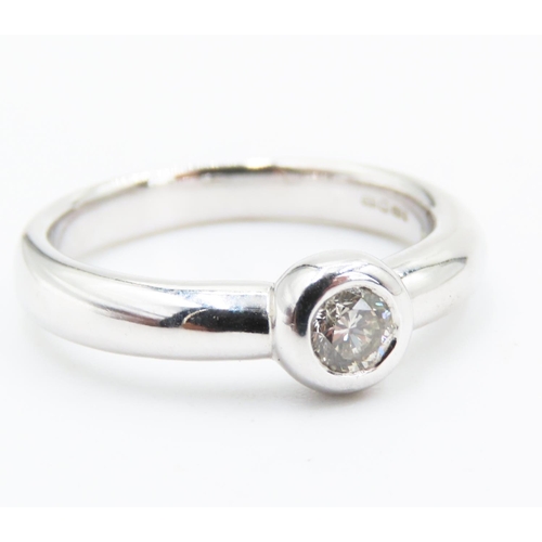 175 - Diamond Solitaire Ring Rub Over Setting Mounted on 9 Carat White Gold Band Ring Size N and A Half