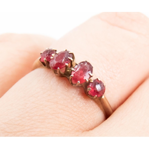 18 - Ruby Four Stone Set Ring Mounted in 9 Carat Rose Gold Ring Size O