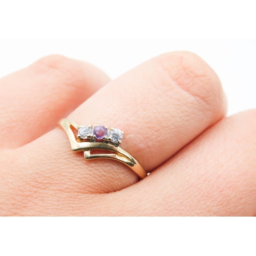 181 - Amethyst and Gemstone Set Ladies Three Stone Ring Mounted in 9 Carat Yellow Gold Ring Size O