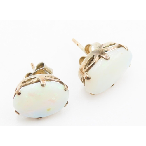 182 - Pair of Six Claw Basket Set Opal Earrings Mounted in 14 Carat Yellow Gold Each 1.2cm High