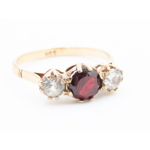 183 - Three Stone Red Garnet and Gemstone Set Ladies Ring Mounted in 9 Carat Yellow Gold Ring Size K