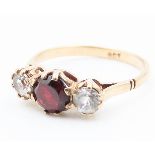 183 - Three Stone Red Garnet and Gemstone Set Ladies Ring Mounted in 9 Carat Yellow Gold Ring Size K