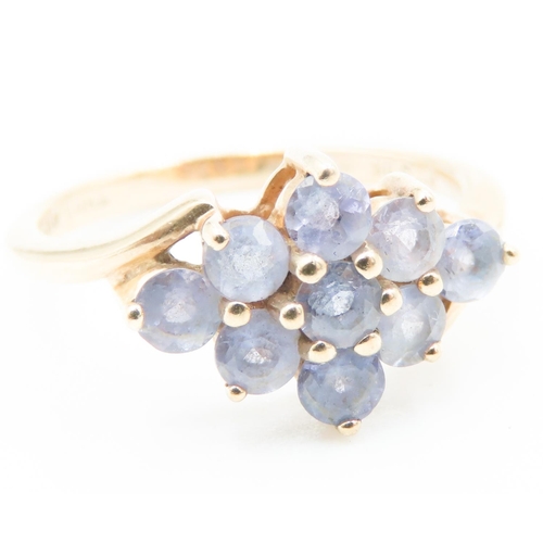 192 - Nine Stone Pale Tanzanite Cluster Ring Mounted in 9 Carat Yellow Gold Ring Size M