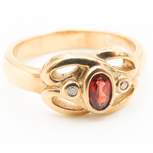 198 - Bezel Set Red Garnet and Diamond Set Knot Form Ring Mounted in 9 Carat Yellow Gold Ring Size M