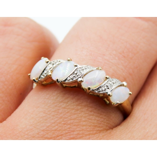 217 - Opal Four Stone Ring Set in 9 Carat Yellow Gold with further Diamond Insets to Setting Ring Size Q