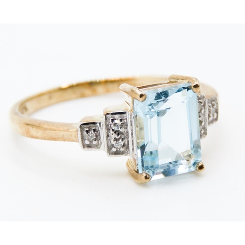 218 - Emerald Cut Aquamarine Set Ring Mounted in 9 Carat Yellow Gold Further Diamonds Set to Shoulders Rin... 