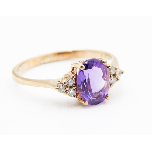 219 - Oval Cut Amethyst and Gemstone Set Ring Mounted in 9 Carat Yellow Gold Ring Size M