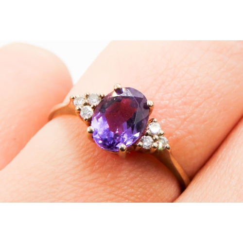 219 - Oval Cut Amethyst and Gemstone Set Ring Mounted in 9 Carat Yellow Gold Ring Size M