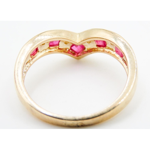 233 - Ruby and Diamond Set Ladies Nine Stone Wishbone Ring Mounted in 9 Carat Yellow Gold Ring Size N