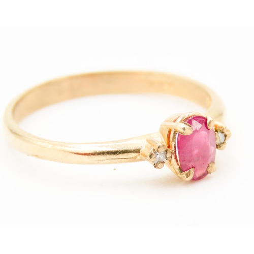 239 - Oval Cut Ruby Centre Stone Ring Mounted in 9 Carat Yellow Gold Further Diamonds Set to Shoulders Rin... 