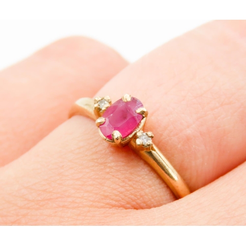 239 - Oval Cut Ruby Centre Stone Ring Mounted in 9 Carat Yellow Gold Further Diamonds Set to Shoulders Rin... 