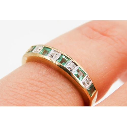 243 - Emerald and Diamond Set Ladies Nine Stone Ring Mounted in 9 Carat Yellow Gold Ring Size L