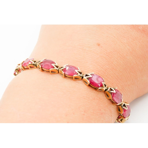 246 - Fourteen Stone Ruby Set Ladies Bracelet Attractively Detailed Mounted in 9 Carat Yellow Gold 19.5cm ... 