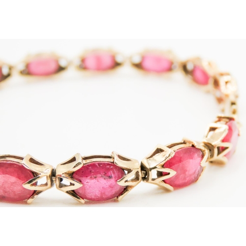 246 - Fourteen Stone Ruby Set Ladies Bracelet Attractively Detailed Mounted in 9 Carat Yellow Gold 19.5cm ... 