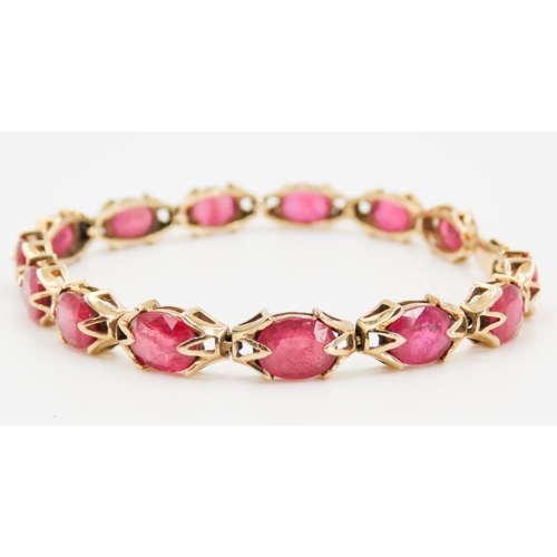 246 - Fourteen Stone Ruby Set Ladies Bracelet Attractively Detailed Mounted in 9 Carat Yellow Gold 19.5cm ... 