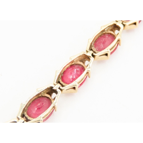 246 - Fourteen Stone Ruby Set Ladies Bracelet Attractively Detailed Mounted in 9 Carat Yellow Gold 19.5cm ... 