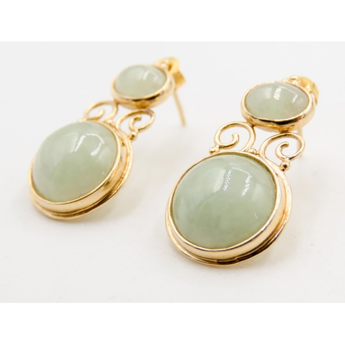 268 - Pair of Attractively Detailed Bezel Set Jade Drop Earrings Mounted in 9 Carat Yellow Gold 3cm High