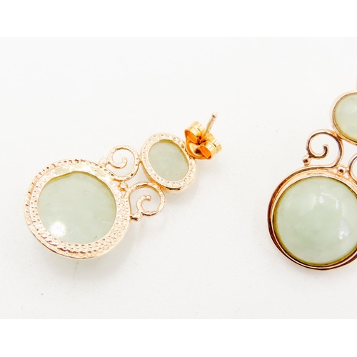 268 - Pair of Attractively Detailed Bezel Set Jade Drop Earrings Mounted in 9 Carat Yellow Gold 3cm High