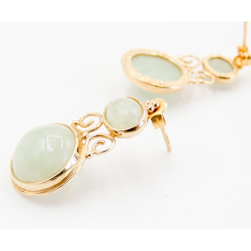 268 - Pair of Attractively Detailed Bezel Set Jade Drop Earrings Mounted in 9 Carat Yellow Gold 3cm High